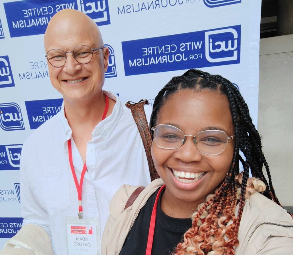 A selfie of Ayanda with Adam Oxford from OpenUp.
